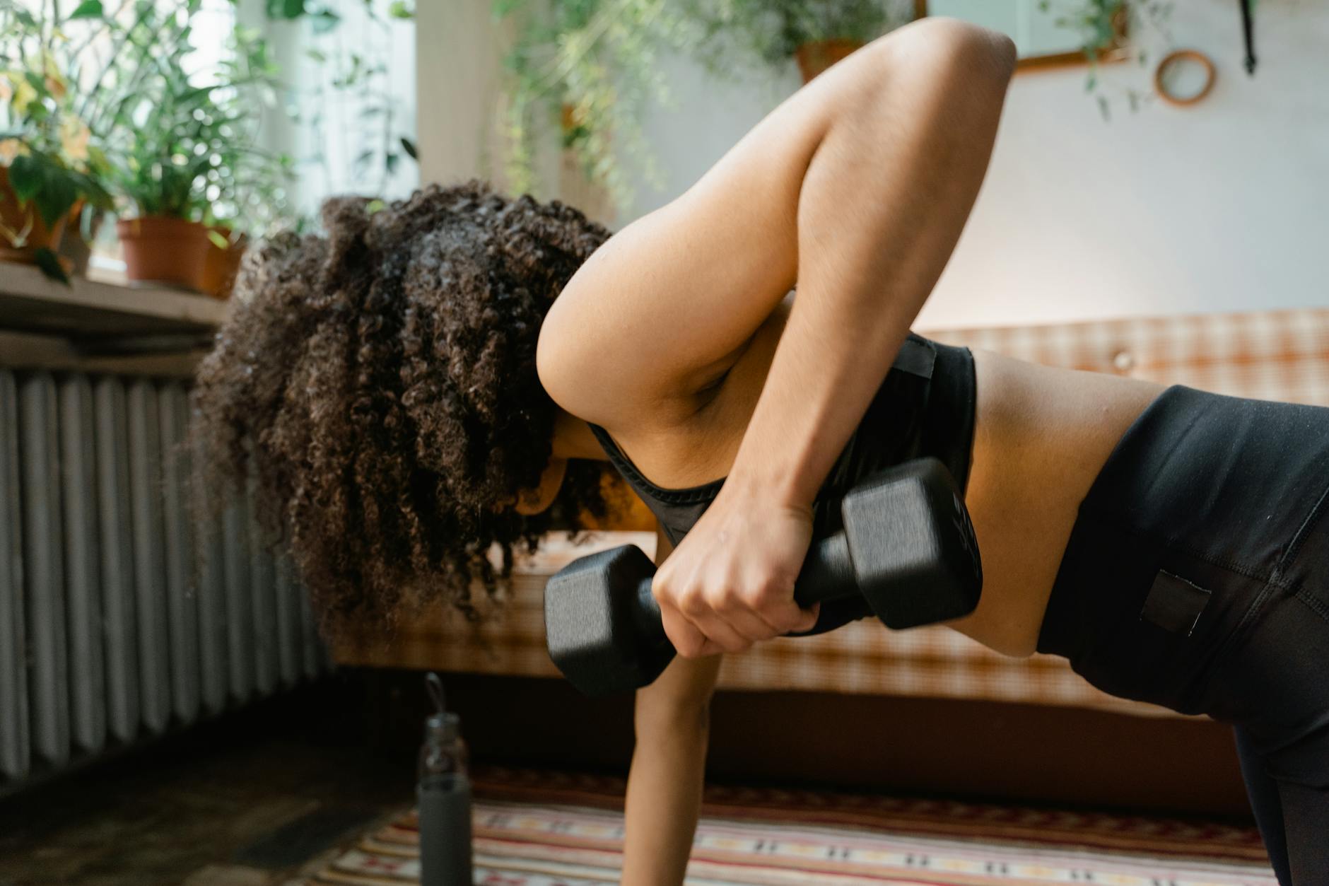 a woman holding a dumbbell
